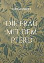 Der Text lautet: "Elke Schrader. Die Frau mit dem Pferd." Hintergrund: Florales Muster in Blau und Beige.