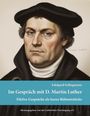 Buchtitel: "Im Gespräch mit D. Martin Luther". Illustration eines ernsten Mannes in schwarzer Kleidung und Mütze.