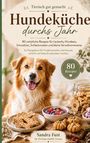 "Tierisch gut gemacht - Hundeküche durchs Jahr." Ein fröhlicher Hund neben Plätzchen und Beeren in Schalen.