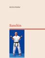 Text: "Achim Keller" und "Sanchin". Ein Mann in Karate-Kleidung in Kampfstellung vor blauem Hintergrund.