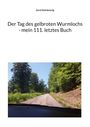 Oben "Gerd Steinkoenig", darunter "Der Tag des gelbroten Wurmlochs - mein 111. letztes Buch". Foto: Straße im Wald.