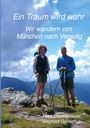 „Ein Traum wird wahr. Wir wandern von München nach Venedig.“ Zwei Wanderer mit Stöcken auf einem Berg, blauer Himmel.