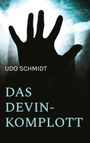 Text: "UDO SCHMIDT DAS DEVIN-KOMPLOTT." Eine Hand streckt sich vor einem hellen, bläulichen Hintergrund.