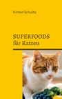 Text: "Kirsten Schultiz" und "SUPERFOODS für Katzen". Eine orange-weiße Katze neben Blaubeeren und Brokkoli.