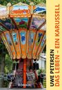 Uwe Petersen: Das Leben - Ein Karussell. Roman. Ein bunt bemaltes Karussell mit leeren Sitzen und Ketten.