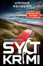 Titel: "Grabesweg Sylt Krimi"; Autorin: Krinke Rehberg. Dünenlandschaft mit rotem Surfbrett am Strand.