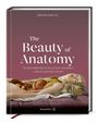 Buchtitel: "The Beauty of Anatomy". Illustration: Wachspuppe mit geöffnetem Brustkorb auf Kissen liegend.