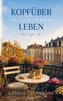 Text: "KOPFÜBER in ein neues LEBEN" und "Gabriele Bernhard". Ein Balkon mit Tisch, Blumen, Buch und Tasse, im Hintergrund Häuser.