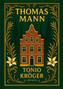“THOMAS MANN" und "TONIO KRÖGER" in Gelb. Illustration eines roten Hauses mit gelbem Rahmen, Floralmuster und grüner Kulisse.