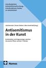 Titel: Antisemitismus in der Kunst. Herausgeber: Julia Bernstein, Florian Diddens, Mira Anneli Naß. Verlag: Nomos. Geometrische blaue Muster.