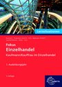Text: Lernsituationen, Fokus Einzelhandel, Kaufmann/Kauffrau im Einzelhandel, 1. Ausbildungsjahr, 3. Auflage.  
Bild: Einkaufszentrum mit Rolltreppen.