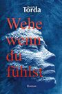 "Wehe wenn du fühlst" von Marietta Torda. Roman. Darstellung eines stilisierten Gesichtes in Blau und Weiß.
