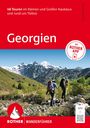 48 Touren im Kaukasus, Georgien, ROTHER WANDERFÜHRER. Zwei Wanderer in bergiger Landschaft mit Schnee.