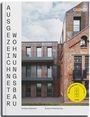 „AUSGEZEICHNETER WOHNUNGSBAU“ steht senkrecht. Modernes Gebäude aus Backstein und Metallpaneelen.