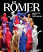 "RÖMER. Gesichter eines Weltreiches." Bunte Statuen in verschiedenen Farben, darunter Rot, Blau, Gold, Lila.