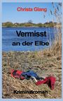 "Vermisst an der Elbe" von Christa Glang. Krimi-Roman. Ufer mit Kleidung, Fluss und Schilf im Hintergrund.