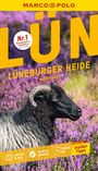 „LÜN Lüneburger Heide“, „Nr. 1 meistgekaufter Reiseführer“. Ein schwarzes Schaf auf lila Heideblumenfeld.