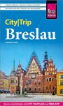 "City|Trip Breslau" von Izabella Gawin. Farbenfrohes Rathaus mit vielen Fenstern und Uhr auf einem historischen Platz.