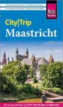 "City|Trip Maastricht" steht groß in der Mitte. Oben: Aktivitäten in Maastricht. Unten: Ulrike Grafberger. Hintergrund: Stadtansicht mit Bäumen.