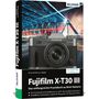 „Fujifilm X-T30 III“ Praxisbuch mit Kameraabbildung, blauem Brückendesign und nächtlichem Stadtbild im Hintergrund.