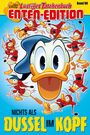 Oben steht “Lustiges Taschenbuch Enten-Edition”. Unten „Nichts als Dussel im Kopf“. Große Ente im Zentrum, umgeben von kleinen Enten.