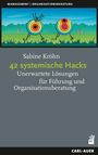 Text: "42 systemische Hacks: Unerwartete Lösungen für Führung und Organisationsberatung." Zwei Zielscheiben auf einer Wiese.
