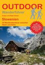 OUTDOOR Wanderführer Slowenien, 25 Abenteuer. Hütte vor imposanten Bergen, zwei Wanderer, himmelblauer Hintergrund.