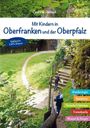 Buchcover: "Mit Kindern in Oberfranken und der Oberpfalz". Zwei Kinder auf einem Waldweg, umgeben von grünem Laub.