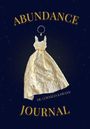 "ABUNDANCE JOURNAL" von Dr. Cornelia Kawann, mit einem goldenen Kleid vor dunklem Hintergrund.