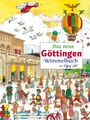 Text: "Das neue Göttingen-Wimmelbuch".  
Illustration: Lebhafte Szene vor einem Bahnhof. Menschen, Tiere, Ballon.