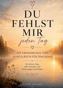Text: "Du fehlst mir jeden Tag. Ein Erinnerungs- und Ausfüllbuch für Trauernde." Im Hintergrund Sonnenaufgang über einem See.