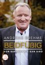 "Andreas Brehme: Beidfüßig - Von Barmbek bis San Siro". Fröhlicher Mann im Anzug, Hintergrund in warmen Farben. ZODIAC-Logo.