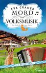 „Mord mit Volksmusik“, ein Fall für Romy Fuchs, ein Bayernkrimi. Ein Hase, eine Ziehharmonika, ein Dorf mit Bergen im Hintergrund.