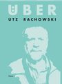 Text: "ÜBER," "UTZ RACHOWSKI," "THELEM." 
Abstraktes Porträt eines Mannes in blauem Hintergrund.