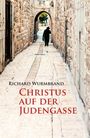 "Richard Wurmbrand, Christus auf der Judengasse" steht groß über einer alten, steinernen Gasse mit einer Person in der Ferne.