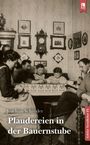 "Plaudereien in der Bauernstube" von Joachim Schröder. Eine Familie sitzt in einer gemütlich eingerichteten Stube.