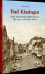 "Bad Kissingen: Eine historische Bilderreise in die 50er- und 60er-Jahre" von Victoria May. Straße mit alten Autos.