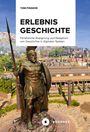 Text: "TOM PINSKER ERLEBNIS GESCHICHTE, Persönliche Aneignung und Rezeption von Geschichte in digitalen Spielen." Eine Bronze-Statue eines Kriegers vor antiken Gebäuden.