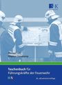 „Taschenbuch für Führungskräfte der Feuerwehr“; Feuerwehrleute betrachten einen Einsatzplan; Verlag-Symbol oben rechts.