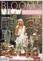 "BLOOM'S View WEDDING No. 12", Themen: Blumenschmuck, Hochzeitsdeko, Landleben. Frau mit Weißem Kleid, Blumen und Kerzen.