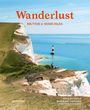"Wanderlust: British & Irish Isles. Hiking the Trails of Great Britain and Ireland. Klippen mit Leuchtturm im Meer."