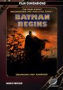 Text: "BATMAN BEGINS", "Ursprung und Abgrund", "Markus Brüchler". Hintergrund: Batman vor einer Stadt im Sonnenuntergang.