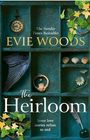 Texte: "The Sunday Times Bestseller", "Evie Woods", "The Heirloom", "Some love stories refuse to end". Kasten mit Efeu und Objekten.
