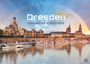 "Dresden 2027, Magisches Elbflorenz." Historische Gebäude am Fluss unter einem Regenbogen, mit Booten im Vordergrund.