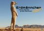„Erdmännchen: Kleine Wächter, große Abenteuer! 2027.“ Ein Erdmännchen steht aufrecht in einer Wüstenlandschaft.