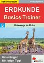 Sekundarstufe, Erdekunde Basics-Trainer, Unterwegs in Afrika. Giraffen und Zebras auf einer Straße, Logo unten rechts.