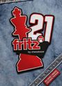 Text: "fritz 21 by chessbase." Design: Rote Schachfigur und Zahlen auf Jeanstoff, Patch-Stil.