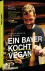 „Ein Bayer kocht vegan“ von Manuel Winbeck. Heimisch, pflanzlich, ohne Grenzen. Foto von Winbeck beim Kochen.