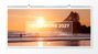 Text: „LIFE is MORE 2027 PANORAMAKALENDER“. Surfer im Meer bei Sonnenuntergang mit Bäumen im Hintergrund.