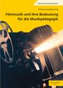 Titel: "Filmmusik und ihre Bedeutung für die Musikpädagogik". Eine Filmprojektor-Linse strahlt Licht aus.